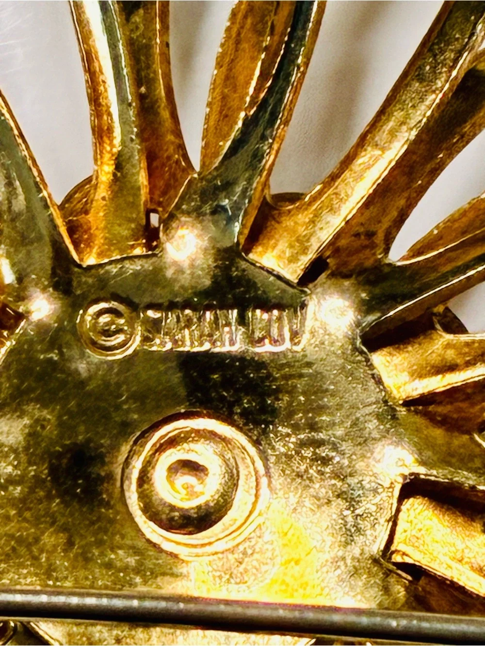 Sarah Coventry Gold-tone Sunburst Brooch with Deep Red Center
